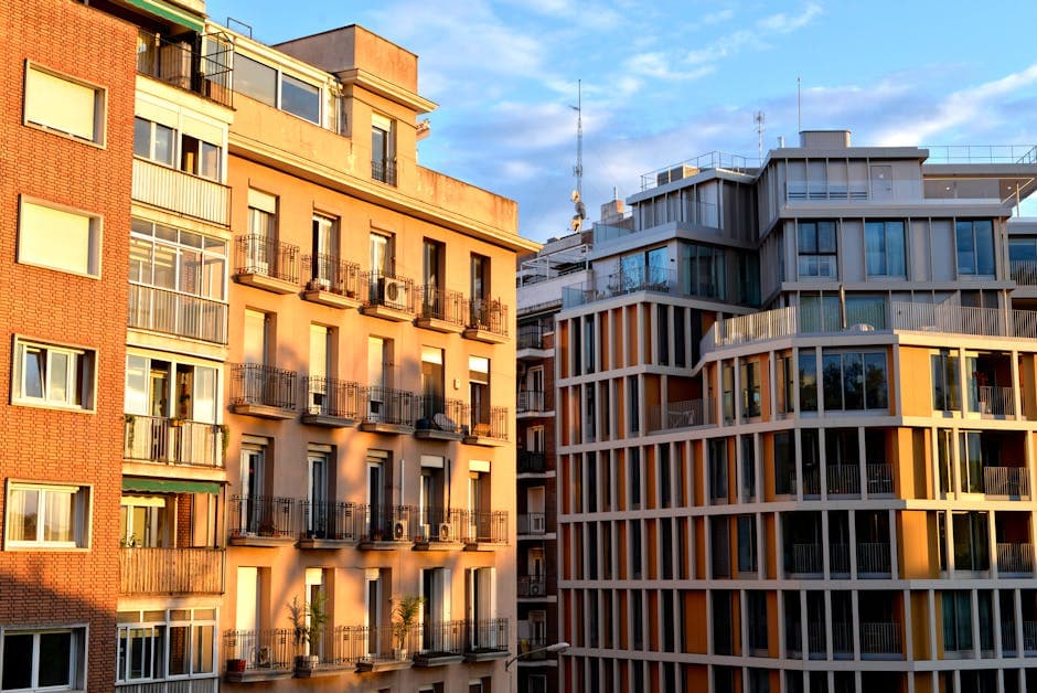 Modern residential development with balconies and glass facades